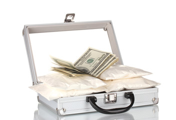 Cocaine with money in a suitcase isolated on white
