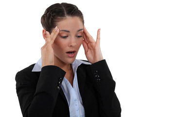 Woman massaging her head