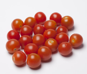 bunch of fresh cherry tomato on white background