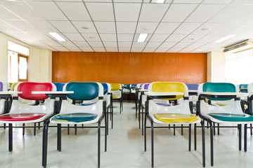 Empty room with many armchairs ront