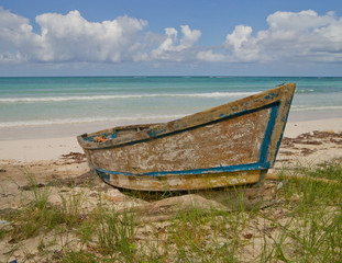 Old wooden boat on Jamaican beach