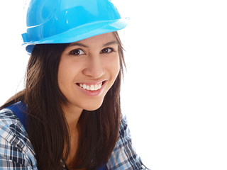 smiling girl wearing blue overall and helmet