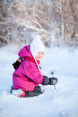 Fototapeta na wymiar Little girl outdoors on winter day