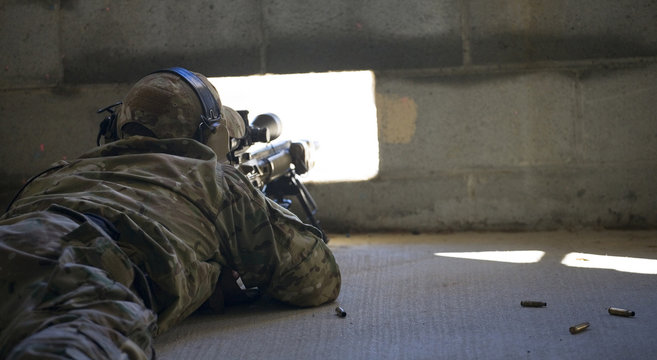 Shot from the Dark delivered by a military sniper in a brick building during a live-fire practice