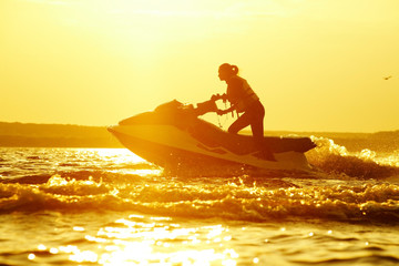 beautiful girl riding her jet skis © yanlev
