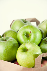 Granny smith apples in a shopping bag, close-up