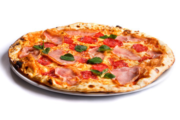 pizza with ham, greens and cheese on a plate