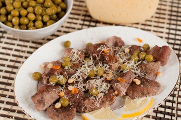 Roast lamb with cheese and green peas