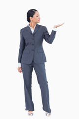 Businesswoman presenting with palm up