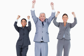 Three cheering businesspeople