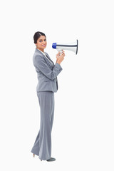 Obraz premium Side view of businesswoman with megaphone