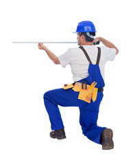 Worker measuring with tape