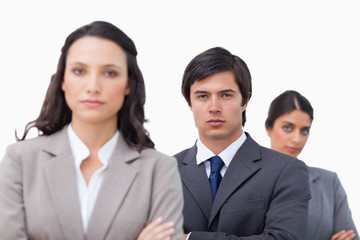 Serious businessteam with arms folded