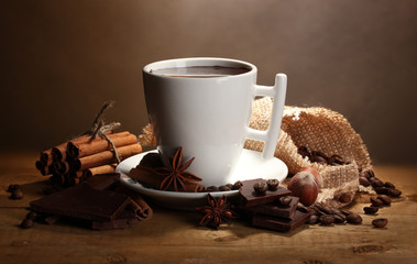 Fototapety  cup of hot chocolate, cinnamon sticks, nuts and chocolate
