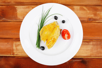 fish fillet with tomatoes,chives and bread