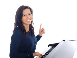 smiling teenage girl playing piano