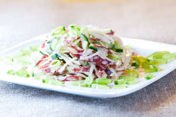 Cabbage salad,cucumber, sausage and green peas