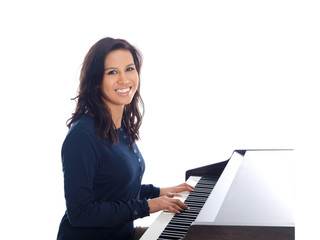 smiling teenage girl playing piano