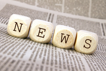 handmade news cubes on newspaper