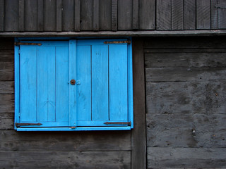 Naklejka na ściany i meble Blue window shutter