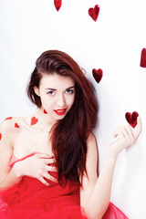 Obraz na płótnie Canvas Brunette girl with red hearts