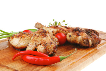 grilled meat : chicken quarters garnished with green sprouts