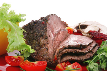 beef on red plate with peppers