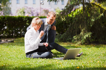 Young business people with laptop