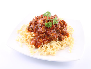 Fusilli bucati lunghi with bolognese sauce on a plate