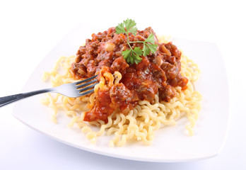 Fusilli bucati lunghi with bolognese sauce being eaten