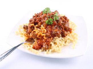 Fusilli bucati lunghi with bolognese sauce being eaten