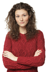 Female in sweater with folded hands, isolated on white