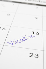 closeup of a calendar with Vacation text