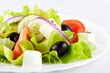Greek salad on white plate