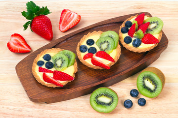 Delicious custard tart with blueberries, kiwi and strawberries