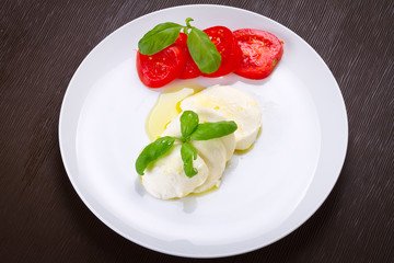 Caprese - italian mozzarella cheese with tomatoes and basil