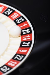 Close view of casino roulette and ball on number