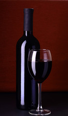 bottle with red wine and glass