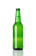 Wet beer bottle isolated on white background