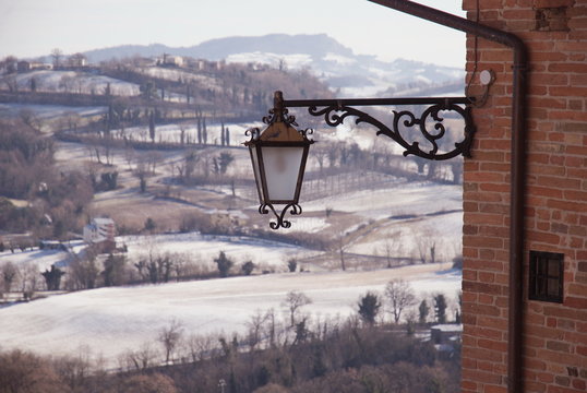 Street lamp and winter landscape, Sarnano, Italy