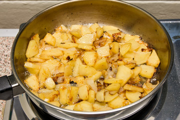 Potatoes fried in a skillet