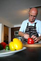 Man cutting peppers