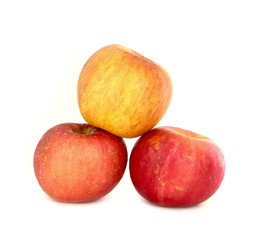 Fresh ripe red and yellow apples on white background