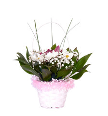 Basket with flowers. Isolated on white