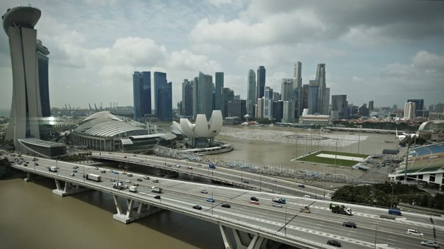 Timelapse Singapore aerial view of the marina bay going down