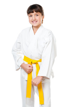 little girl in a kimono with a yellow sash