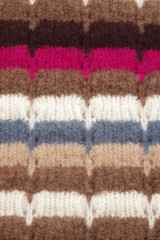 Vertical closeup of multicolored woolen texture