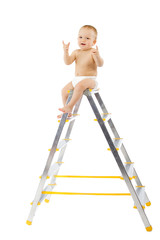 Adorable child sitting on top of stepladder, hands raise up.