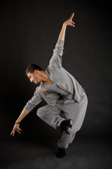 cute stylish dancer in the dance sweatsuit shows