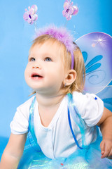 beautiful girl in a fairy costume with butterfly wings